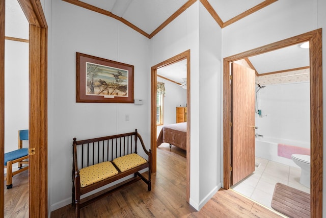 61738 Lake View Dr, Cassopolis, MI 49031 - corridor featuring crown molding, vaulted ceiling, light wood-type flooring, and baseboards