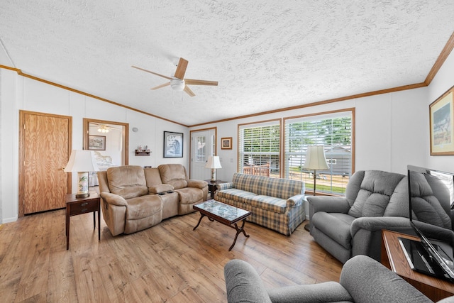 61738 Lake View Dr, Cassopolis, MI 49031 - living area featuring a ceiling fan, lofted ceiling, crown molding, light wood finished floors, and a textured ceiling