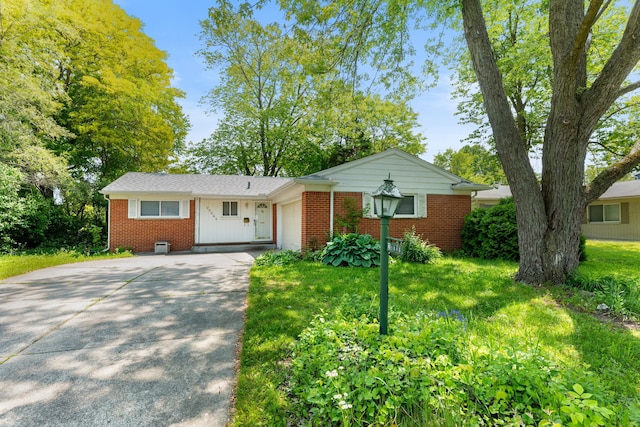 29848 Rambling Rd, Southfield, MI 48076 - ranch-style house featuring brick siding, an attached garage, and driveway