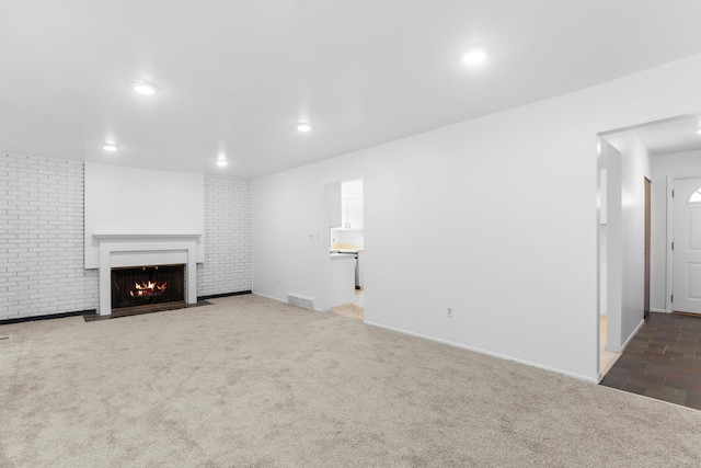 29848 Rambling Rd, Southfield, MI 48076 - unfurnished living room with a fireplace with flush hearth, carpet floors, recessed lighting, and baseboards