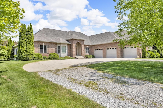 10575 Darrel Dr, Hanover, MI 49241 - french country inspired facade with concrete driveway, brick siding, a garage, a front yard, and a shingled roof
