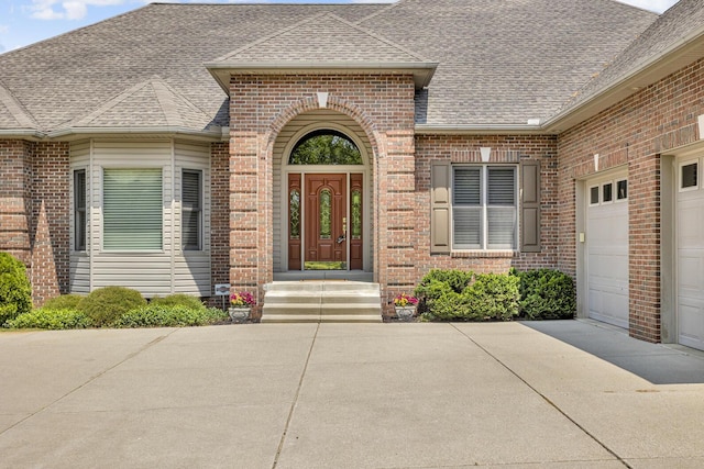 10575 Darrel Dr, Hanover, MI 49241 - entrance to property featuring brick siding, roof with shingles, and driveway