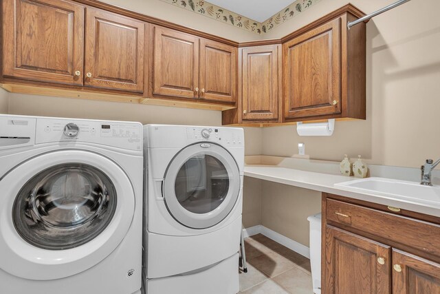 10575 Darrel Dr, Hanover, MI 49241 - laundry area with cabinet space, washing machine and dryer, and light tile patterned floors