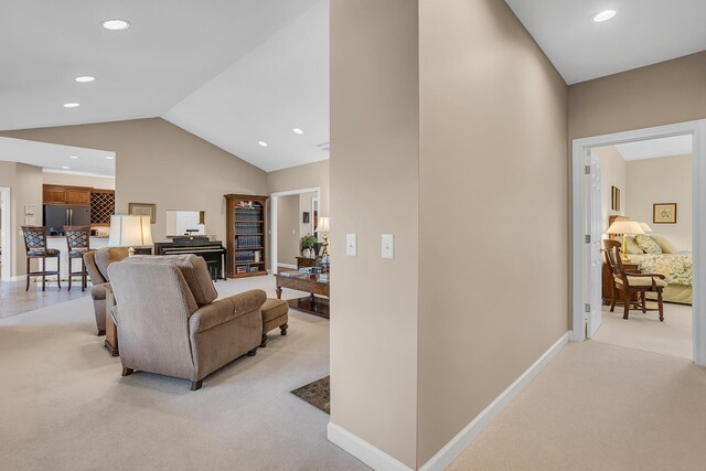 10575 Darrel Dr, Hanover, MI 49241 - living room featuring light carpet, vaulted ceiling, recessed lighting, and baseboards