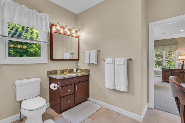 10575 Darrel Dr, Hanover, MI 49241 - bathroom featuring vanity, baseboards, toilet, and tile patterned floors