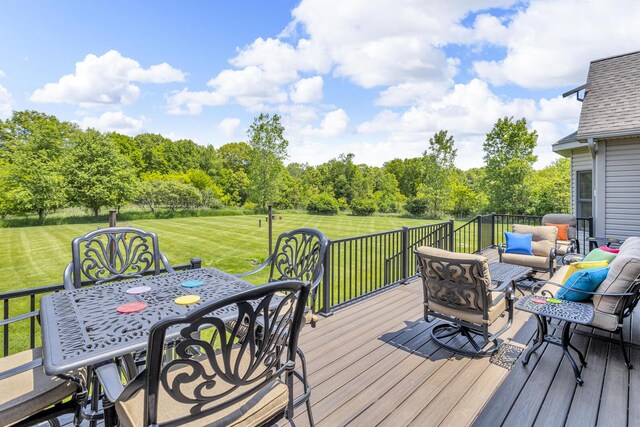 10575 Darrel Dr, Hanover, MI 49241 - wooden terrace with an outdoor living space, a yard, outdoor dining space, and view of wooded area