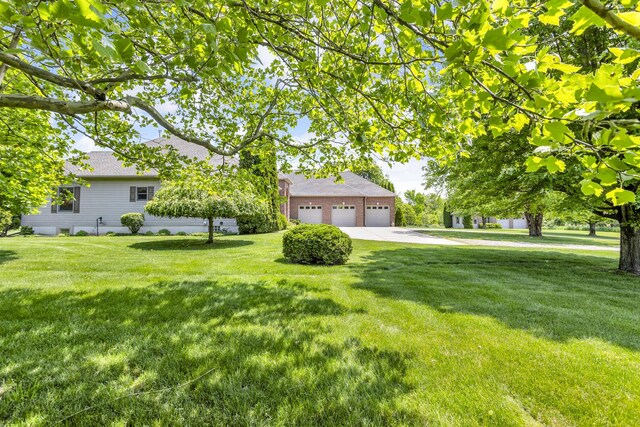 10575 Darrel Dr, Hanover, MI 49241 - view of front of house with a front lawn and a shingled roof