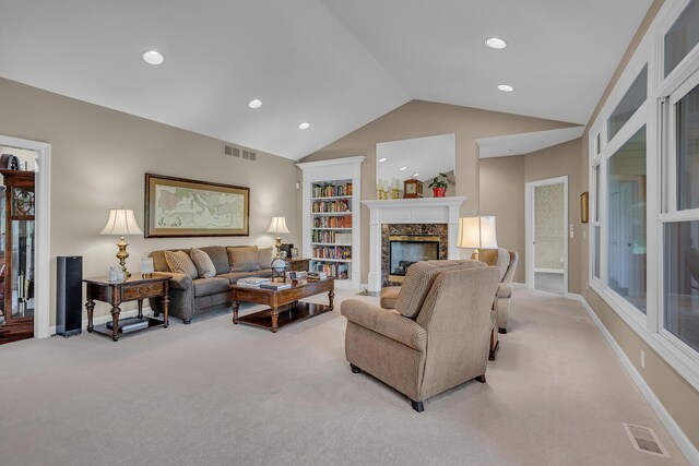 10575 Darrel Dr, Hanover, MI 49241 - living area featuring light carpet, vaulted ceiling, a fireplace, recessed lighting, and baseboards