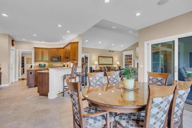 10575 Darrel Dr, Hanover, MI 49241 - dining area featuring recessed lighting, vaulted ceiling, and baseboards