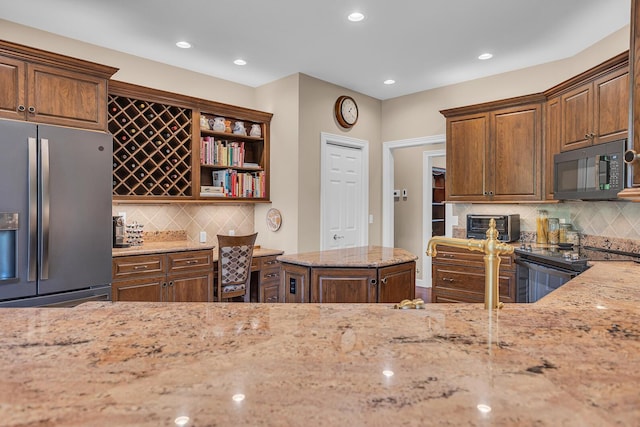 10575 Darrel Dr, Hanover, MI 49241 - kitchen featuring black appliances, light stone countertops, decorative backsplash, open shelves, and recessed lighting