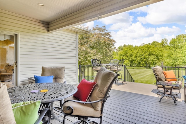 10575 Darrel Dr, Hanover, MI 49241 - wooden terrace with outdoor dining space and view of scattered trees