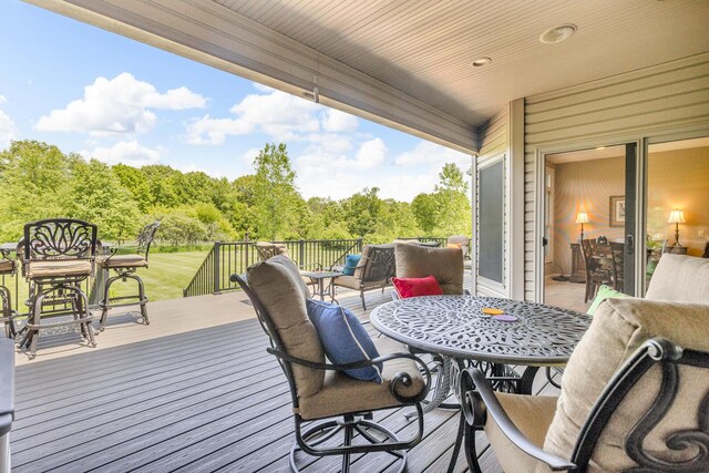 10575 Darrel Dr, Hanover, MI 49241 - wooden terrace featuring outdoor dining area
