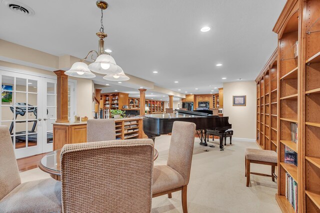 10575 Darrel Dr, Hanover, MI 49241 - dining room with decorative columns, light carpet, recessed lighting, and baseboards