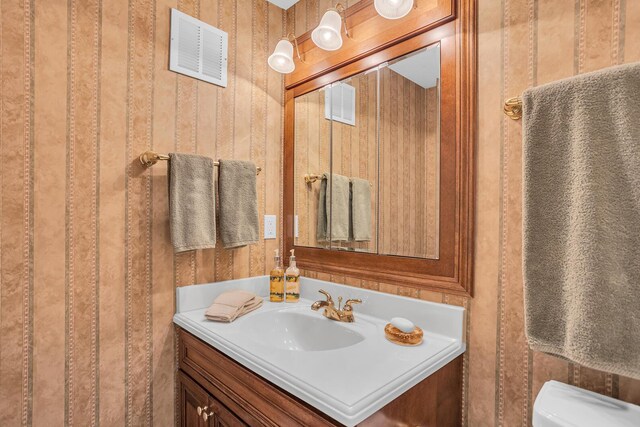 10575 Darrel Dr, Hanover, MI 49241 - half bath featuring vanity and toilet