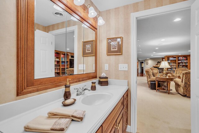 10575 Darrel Dr, Hanover, MI 49241 - bathroom with wallpapered walls, vanity, and recessed lighting