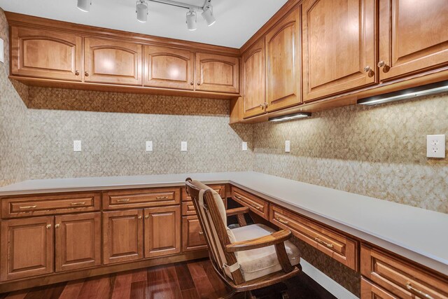 10575 Darrel Dr, Hanover, MI 49241 - kitchen featuring dark wood finished floors, brown cabinetry, light countertops, and tasteful backsplash
