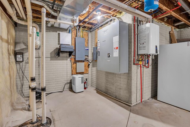 10575 Darrel Dr, Hanover, MI 49241 - utility room with tankless water heater and electric panel