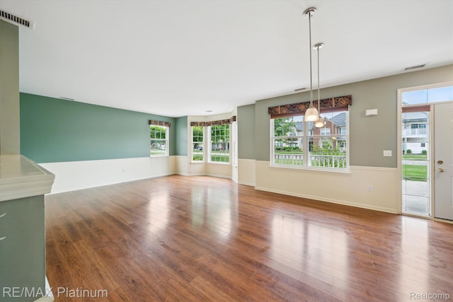 4300 Hampton Ridge Blvd, Howell, MI 48843 - unfurnished room featuring wood finished floors, baseboards, and wainscoting