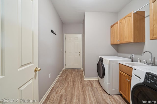 4300 Hampton Ridge Blvd, Howell, MI 48843 - laundry room with washer / dryer, cabinet space, light wood-style flooring, and baseboards