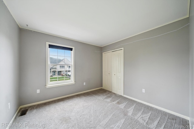 4300 Hampton Ridge Blvd, Howell, MI 48843 - unfurnished bedroom featuring baseboards, carpet, and a closet