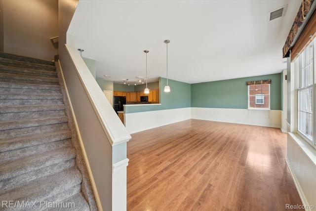 4300 Hampton Ridge Blvd, Howell, MI 48843 - stairs with wood finished floors and baseboards