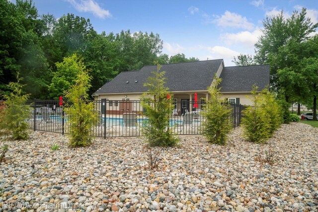 4300 Hampton Ridge Blvd, Howell, MI 48843 - rear view of property featuring a patio area and roof with shingles