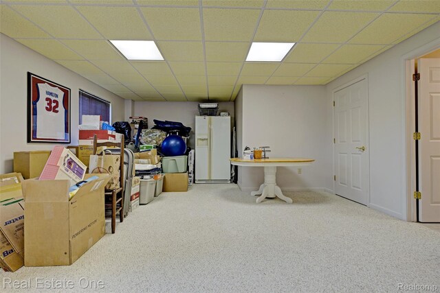2338 Malena Ln, Oxford, MI 48371 - finished basement featuring carpet floors, white fridge with ice dispenser, and a paneled ceiling