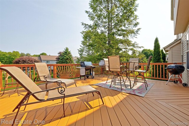 2338 Malena Ln, Oxford, MI 48371 - deck featuring a grill and outdoor dining space