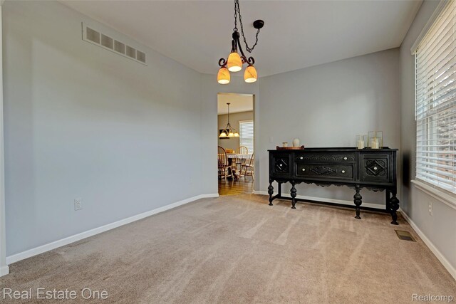 2338 Malena Ln, Oxford, MI 48371 - empty room featuring carpet, healthy amount of natural light, and baseboards