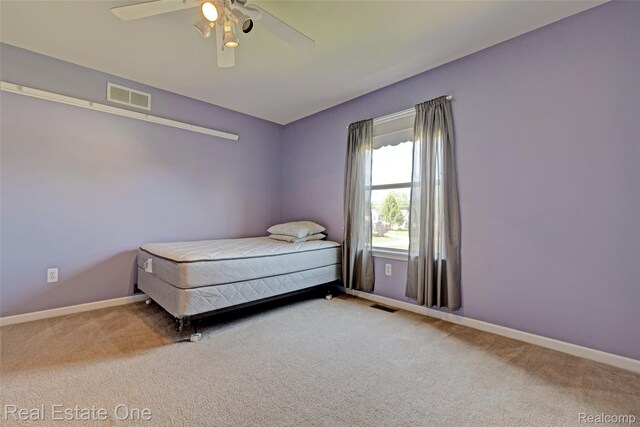 2338 Malena Ln, Oxford, MI 48371 - bedroom with carpet floors, baseboards, and ceiling fan