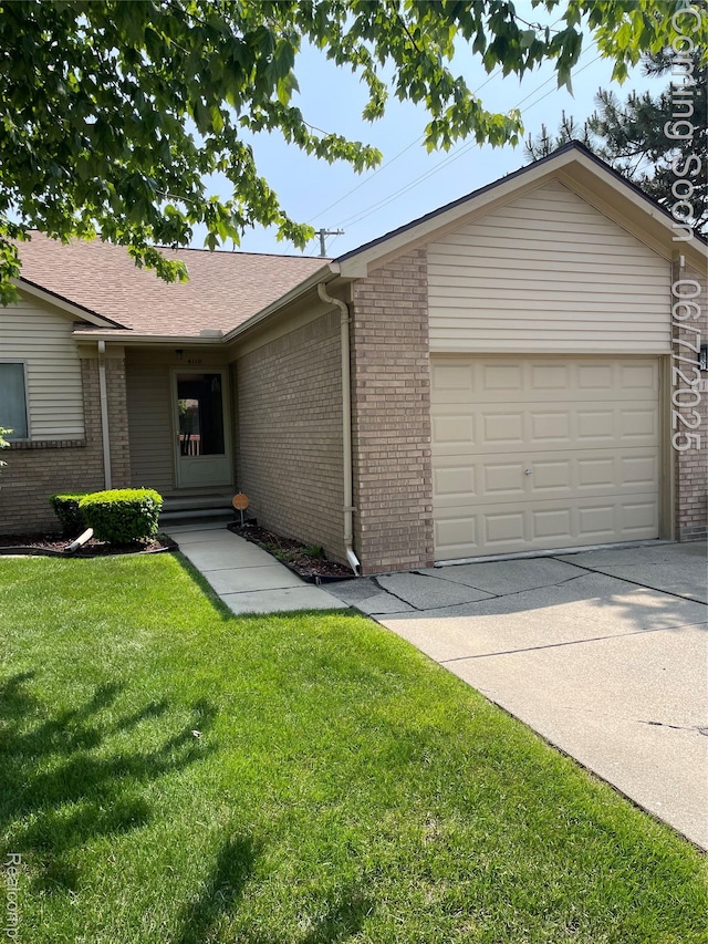 4110 W Cristina Ct S Unit 32, Warren, MI 48091 - single story home with brick siding, an attached garage, and driveway