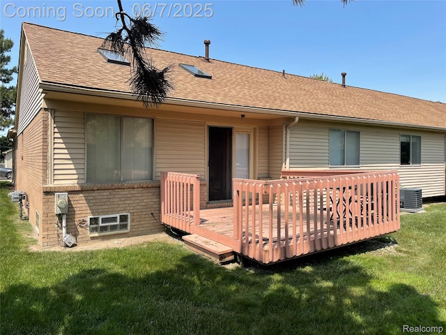 4110 W Cristina Ct S Unit 32, Warren, MI 48091 - back of house with a lawn, central AC unit, a wooden deck, and roof with shingles