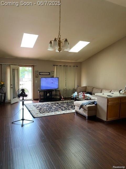 4110 W Cristina Ct S Unit 32, Warren, MI 48091 - living area with a skylight, a chandelier, dark wood-style floors, and lofted ceiling