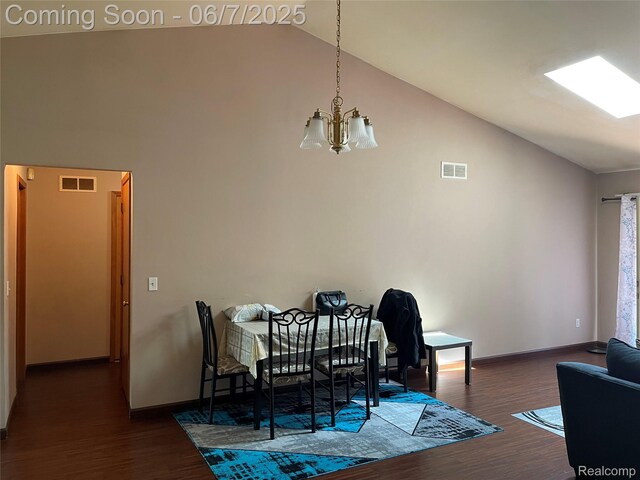 4110 W Cristina Ct S Unit 32, Warren, MI 48091 - dining space featuring high vaulted ceiling, a chandelier, dark wood-style floors, and baseboards