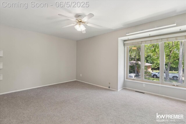 77 Willow Way Unit 13, Waterford, MI 48328 - carpeted empty room featuring a ceiling fan and baseboards