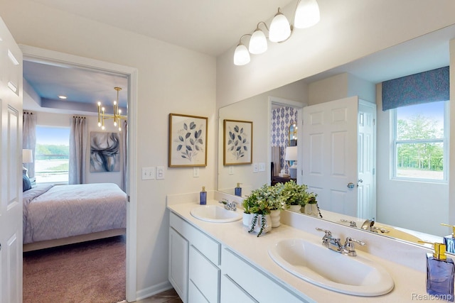 378 Edge Brk, Holly, MI 48442 - ensuite bathroom featuring double vanity and a chandelier