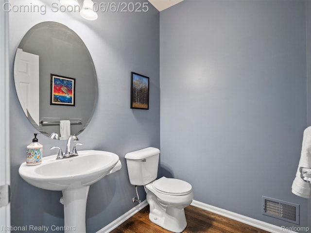 3924 High Grove Way, Lake Orion, MI 48360 - half bathroom with baseboards, wood finished floors, and toilet