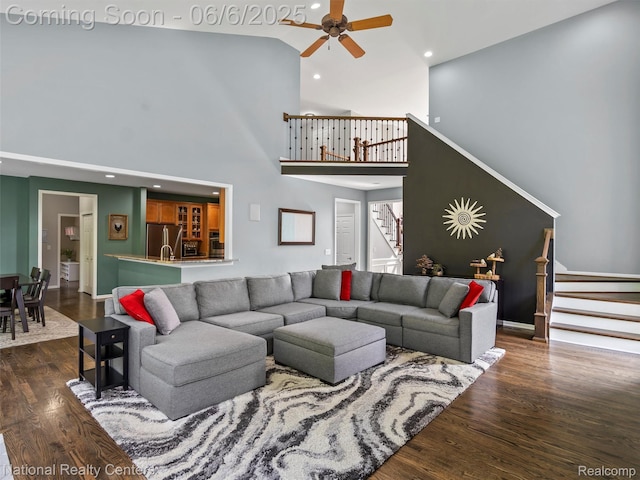 3924 High Grove Way, Lake Orion, MI 48360 - living area featuring a high ceiling, dark wood-style floors, stairs, a ceiling fan, and recessed lighting