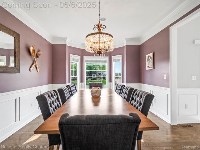 3924 High Grove Way, Lake Orion, MI 48360 - dining space featuring a chandelier, ornamental molding, wainscoting, wood finished floors, and a decorative wall
