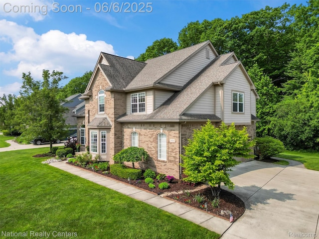 3924 High Grove Way, Lake Orion, MI 48360 - traditional-style home with roof with shingles, brick siding, and a front lawn