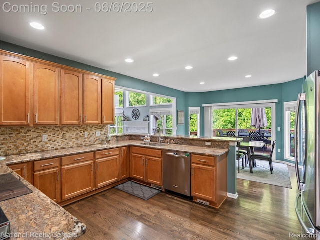 3924 High Grove Way, Lake Orion, MI 48360 - kitchen with stainless steel appliances, a sink, dark wood-style floors, light stone countertops, and recessed lighting