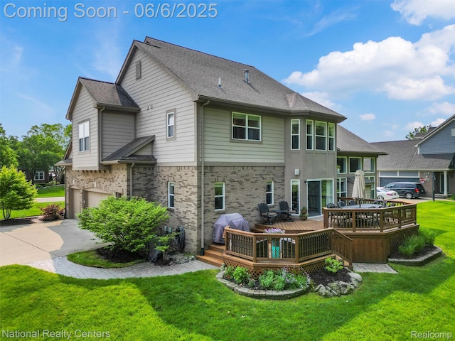 3924 High Grove Way, Lake Orion, MI 48360 - rear view of house featuring a garage, a deck, a lawn, concrete driveway, and brick siding