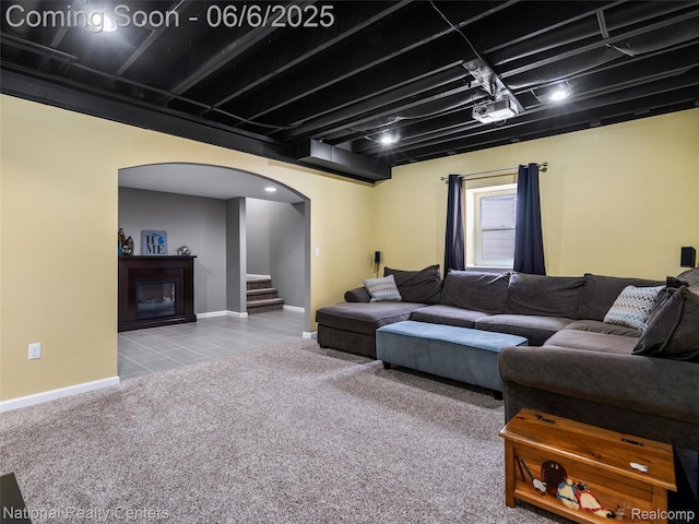 3924 High Grove Way, Lake Orion, MI 48360 - carpeted living room with arched walkways, stairway, baseboards, and a glass covered fireplace