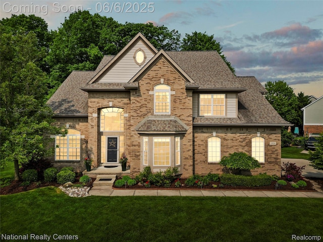 3924 High Grove Way, Lake Orion, MI 48360 - view of front of home featuring a lawn, a shingled roof, and brick siding