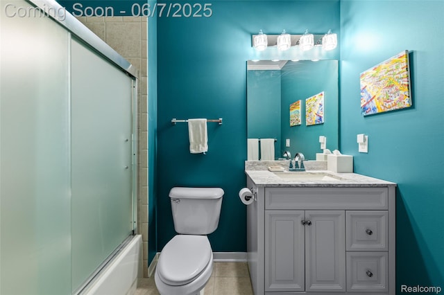 100 W 5th St Unit 504, Royal Oak, MI 48067 - full bathroom featuring toilet, vanity, tile patterned flooring, baseboards, and enclosed tub / shower combo