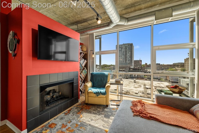 100 W 5th St Unit 504, Royal Oak, MI 48067 - living area with a tiled fireplace and track lighting