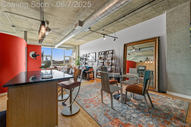 100 W 5th St Unit 504, Royal Oak, MI 48067 - dining space featuring wood finished floors, ceiling fan, and baseboards