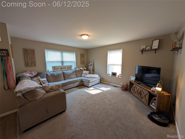 3070 Strong Hts, Grand Blanc, MI 48507 - carpeted living room featuring plenty of natural light and baseboards