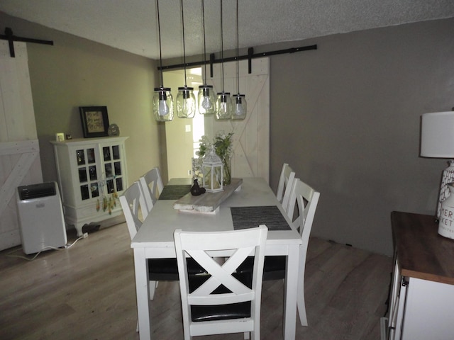 1920 S 15th St, Niles, MI 49120 - dining room featuring a barn door and wood finished floors