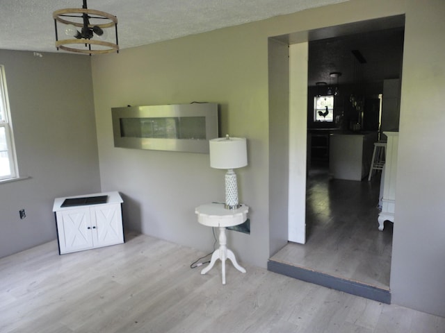 1920 S 15th St, Niles, MI 49120 - unfurnished dining area with wood finished floors and a textured ceiling